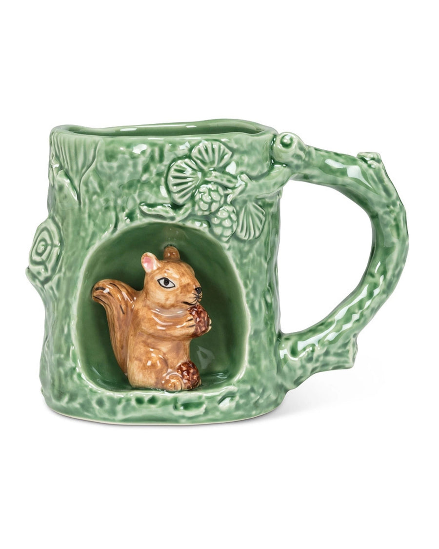 Front view of a green mug with a squirrel figure in a recessed alcove and a handle on the right.