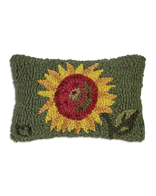 Green rectangular pillow with a large embroidered sunflower and a smiling face design.