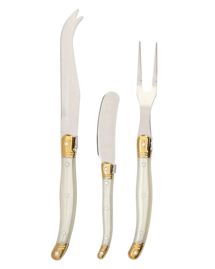 Three-piece cheese knife set with pearl-effect handles and gold-colored details shown separately on a white background.