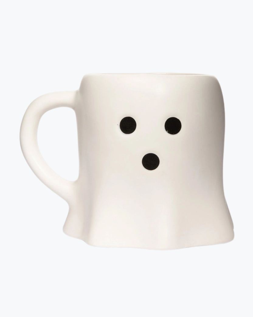 White ghost-shaped coffee mug with a handle on the left and three black circular face markings.