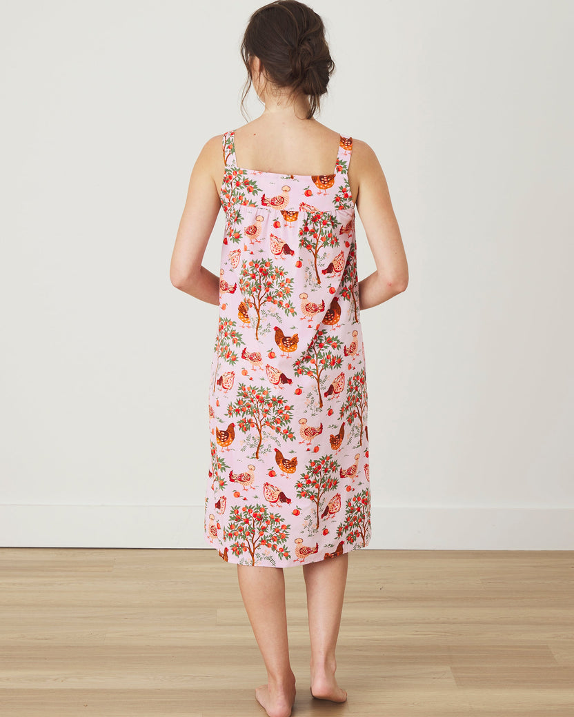 Back view of the Hen House ballet pink nightgown, showing its square back neckline, wide straps, and patterned knee-length design.