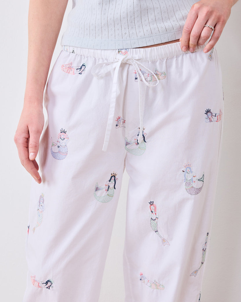 Close front view of the tall pajama pants showing the drawstring waist and mermaid motifs.